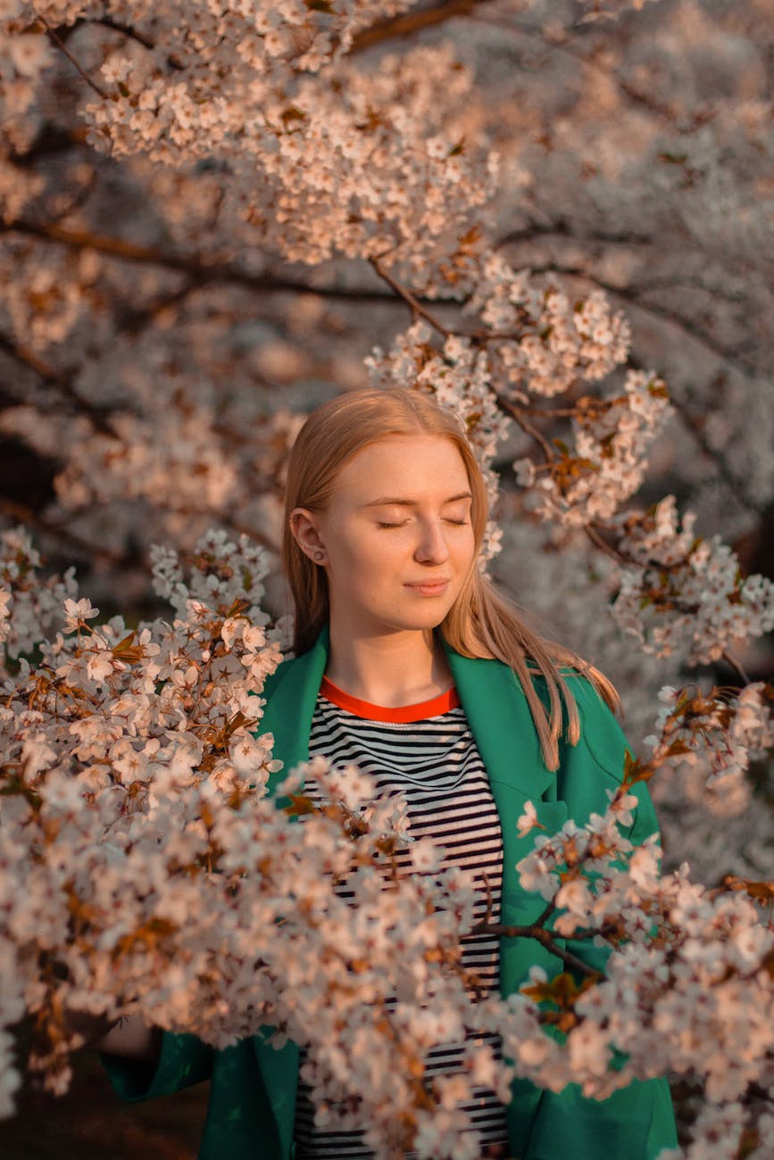 portrait of a woman among cherry blossom